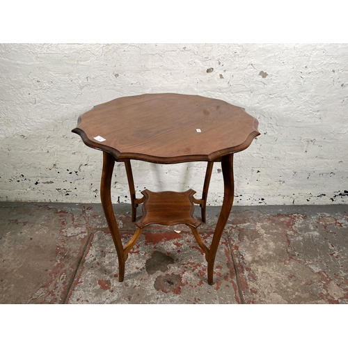 79 - An Edwardian walnut serpentine two tier side table - approx. 70cm x 66cm in diameter