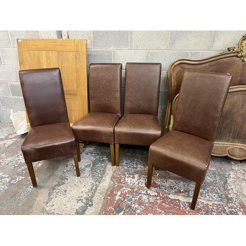 8 - A Bergen solid oak extending dining table and four chestnut brown leatherette and oak roll top chair... 