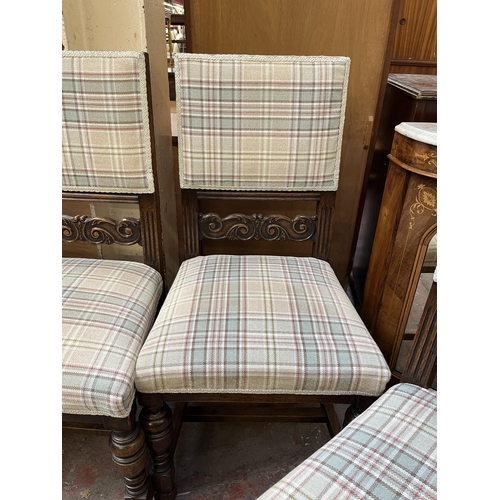 81 - Five carved oak and tartan fabric upholstered dining chairs