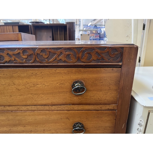 83 - An Edwardian carved mahogany chest of drawers - approx. 102cm high x 91cm wide x 45cm deep