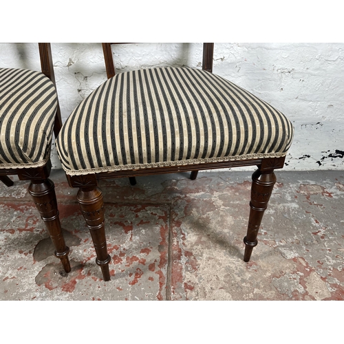 92 - A pair of late 19th century carved mahogany occasional chairs