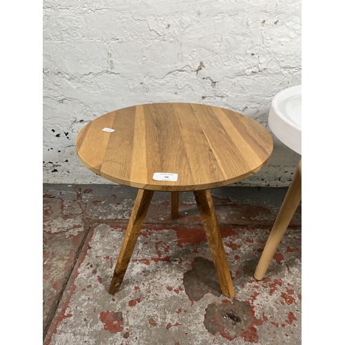 98 - Two modern circular side tables, one oak - approx. 40cm high x 40cm diameter and one white plastic a... 