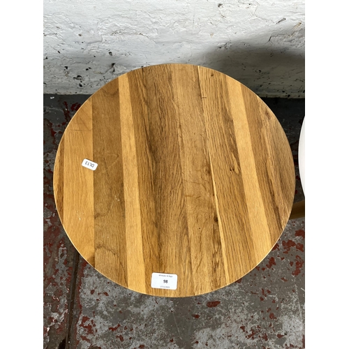 98 - Two modern circular side tables, one oak - approx. 40cm high x 40cm diameter and one white plastic a... 