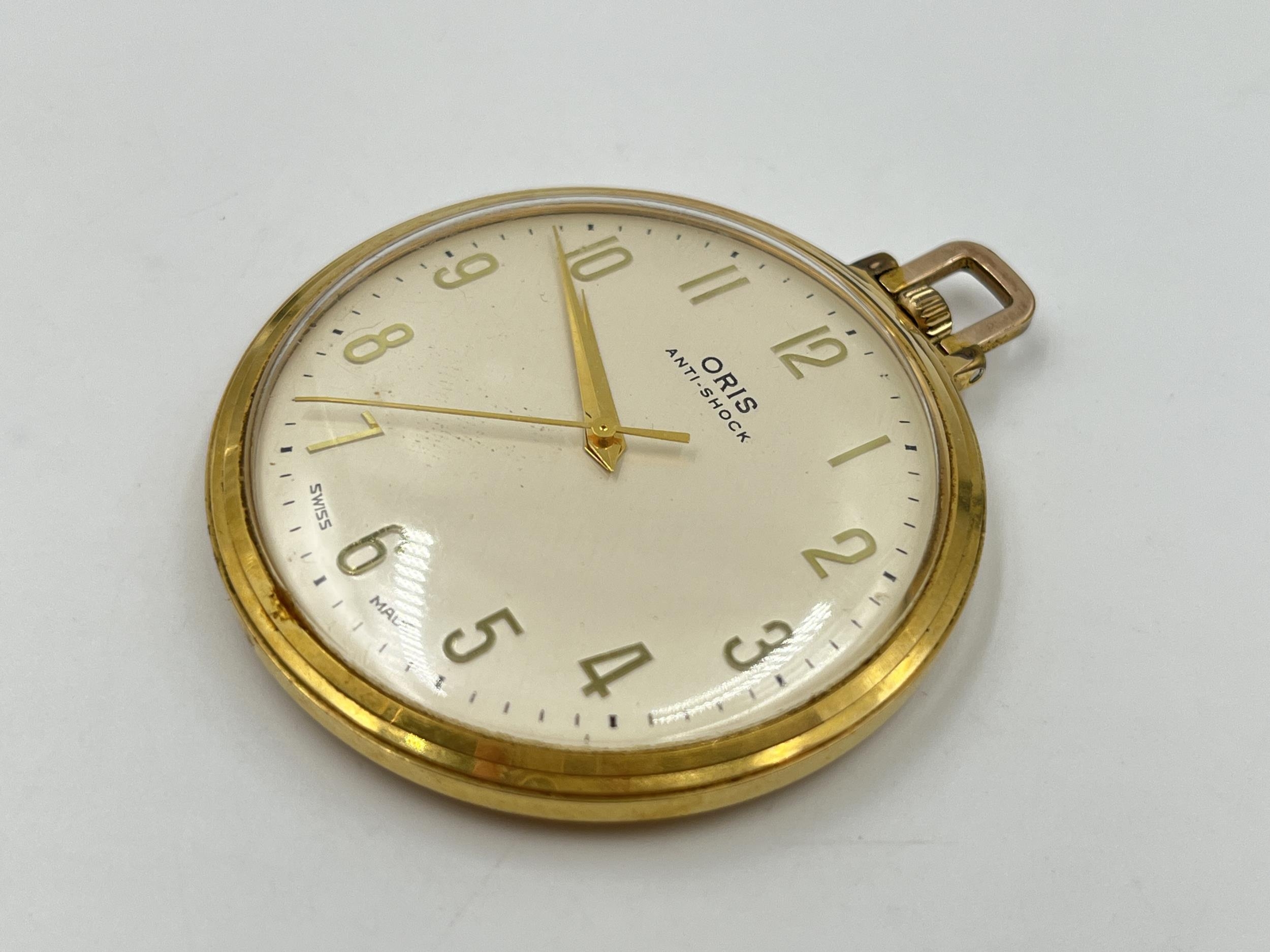 A 1970s Oris anti shock slim open face hand wind pocket watch