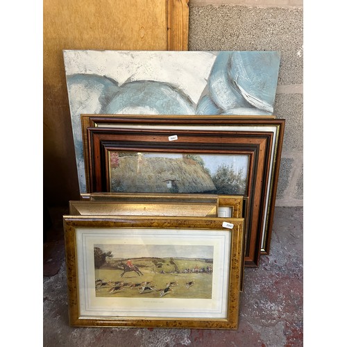 230 - A collection of framed pictures to include early 20th century oil on board of a seascape near Whitby... 