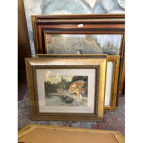 230 - A collection of framed pictures to include early 20th century oil on board of a seascape near Whitby... 