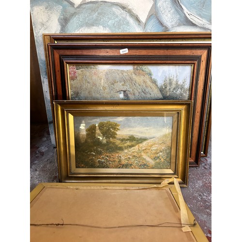 230 - A collection of framed pictures to include early 20th century oil on board of a seascape near Whitby... 