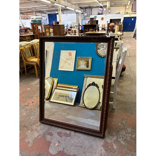 231 - A 19th century style red lacquered and gilt framed bevelled edge wall mirror - approx. 104cm high x ... 