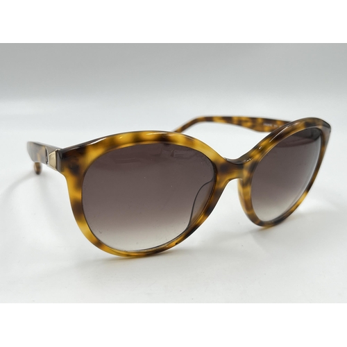 2175 - A pair of Calvin Klein tortoiseshell effect lady's sunglasses