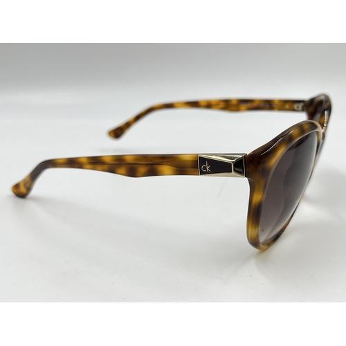 2175 - A pair of Calvin Klein tortoiseshell effect lady's sunglasses