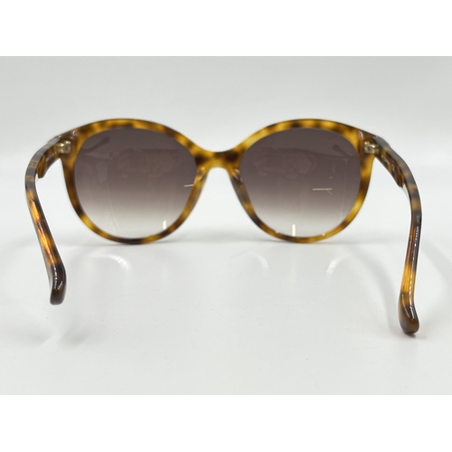 2175 - A pair of Calvin Klein tortoiseshell effect lady's sunglasses