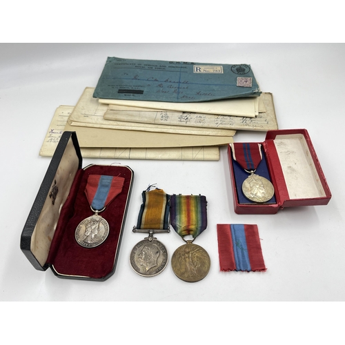 2197 - A collection of early 20th century militaria and medals awarded to Mr Cecil M. Darvill to include WW... 