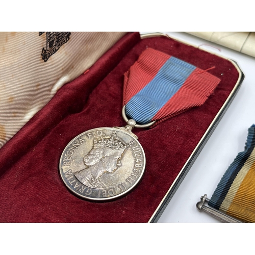 2197 - A collection of early 20th century militaria and medals awarded to Mr Cecil M. Darvill to include WW... 