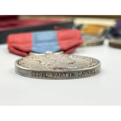 2197 - A collection of early 20th century militaria and medals awarded to Mr Cecil M. Darvill to include WW... 