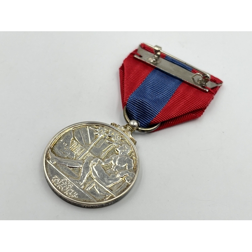 2198 - A boxed Royal Mint faithful service medal awarded to William Ernest Drummond