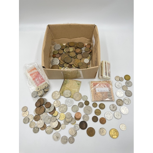 2212 - A collection of world banknotes and coins to include 50% silver 1963 Australian sixpence etc.