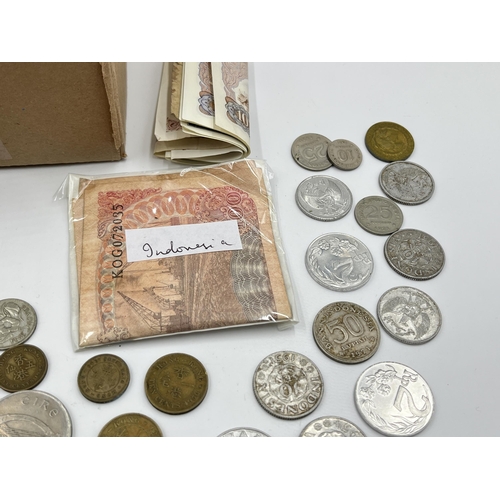 2212 - A collection of world banknotes and coins to include 50% silver 1963 Australian sixpence etc.