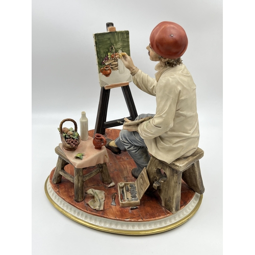 288 - A Capodimonte porcelain figurine of an artist painting a still life scene - approx. 29cm high