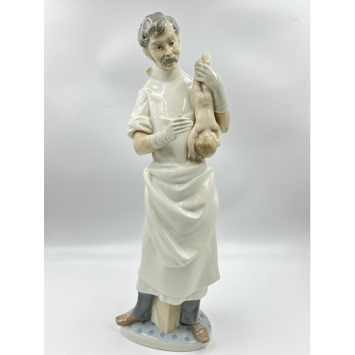 296 - A Lladro no. 4763 Obstetrician Doctor porcelain figurine - approx. 42cm high