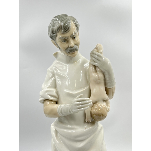 296 - A Lladro no. 4763 Obstetrician Doctor porcelain figurine - approx. 42cm high