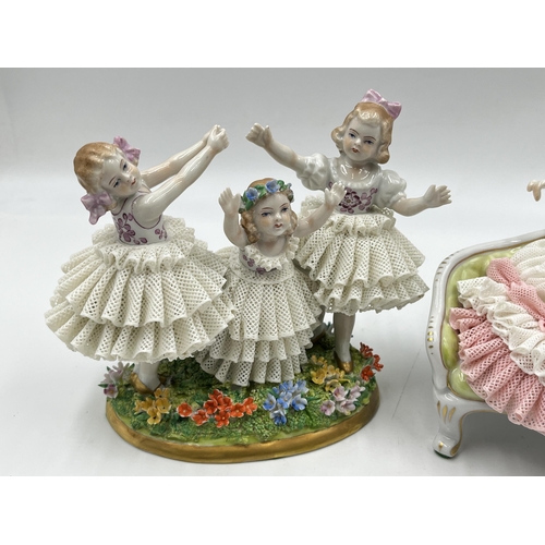 300 - Two German lace porcelain figurines, one Dresden seated ballerina and one Volkstedt