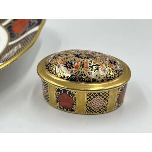 309 - Two pieces of Royal Crown Derby Old Imari 1128 bone china, one lidded trinket box and one dish