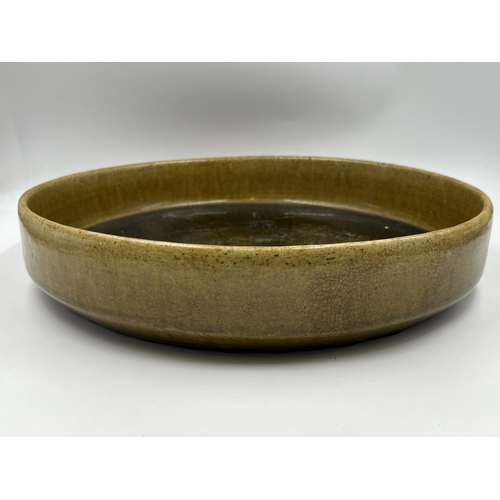 311 - A Thai celadon earthenware bowl - approx. 6.5cm high x 33cm in diameter