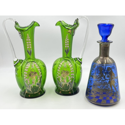 313 - Three pieces of 19th century glassware, one Venetian decanter with silver overlay and a pair of gree... 