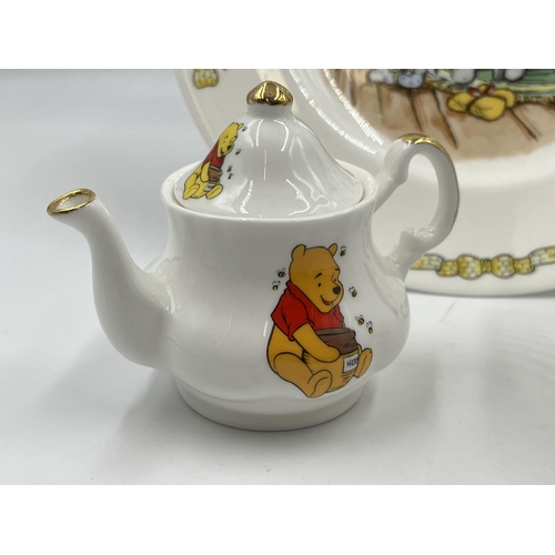 330 - Three pieces of Winnie the Pooh pottery, two Royal Doulton and one Staffordshire