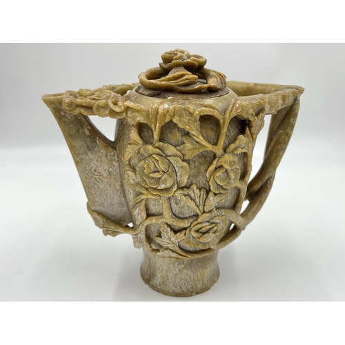 334 - A Chinese export heavily carved soapstone teapot