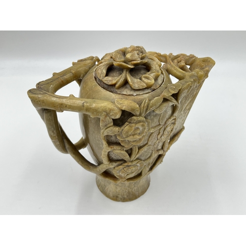 334 - A Chinese export heavily carved soapstone teapot