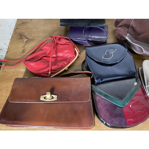 489 - A large collection of assorted handbags