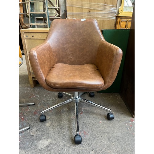 30 - A brown faux leather and chrome plated swivel desk chair