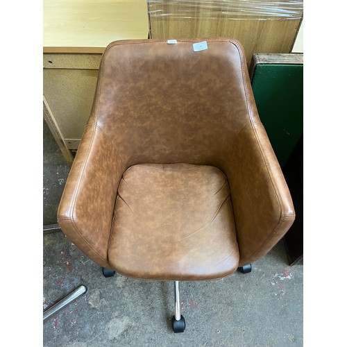 30 - A brown faux leather and chrome plated swivel desk chair