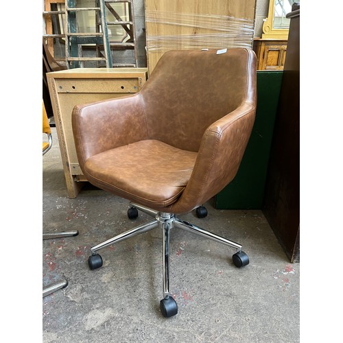 30 - A brown faux leather and chrome plated swivel desk chair