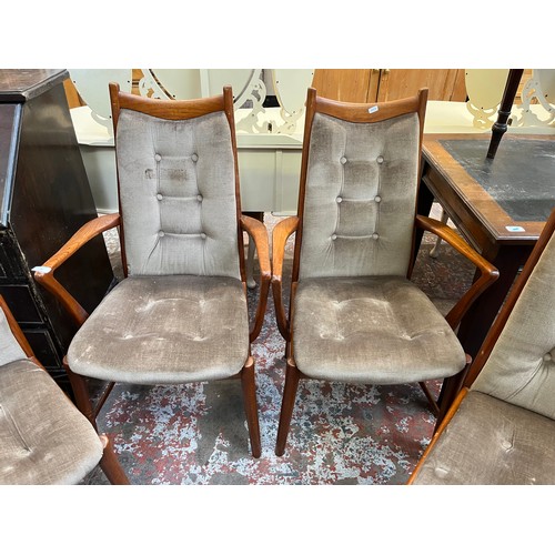 33 - Four mid 20th century teak and fabric upholstered dining chairs