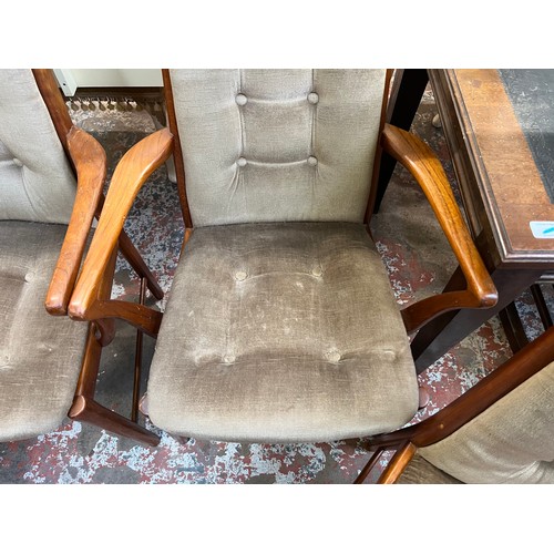 33 - Four mid 20th century teak and fabric upholstered dining chairs