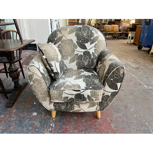 88 - A modern brown and cream floral fabric upholstered armchair