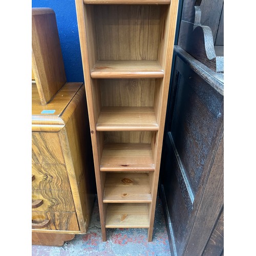 90 - A pine eleven tier CD rack - approx. 119cm high x 24cm wide x 18cm deep