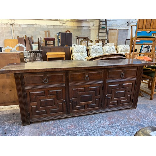 104 - A carved hardwood sideboard - approx. 78cm high x 205cm wide x 42cm deep