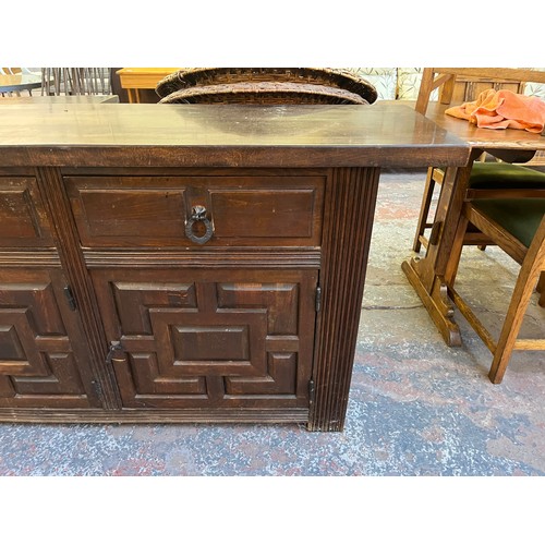 104 - A carved hardwood sideboard - approx. 78cm high x 205cm wide x 42cm deep