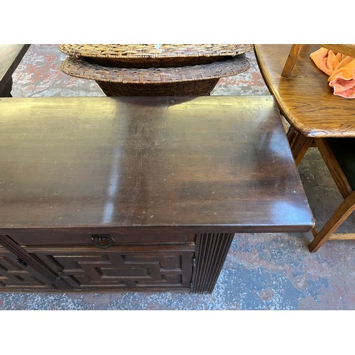 104 - A carved hardwood sideboard - approx. 78cm high x 205cm wide x 42cm deep