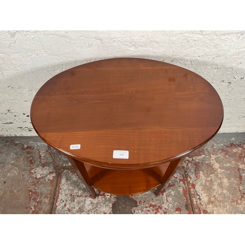 108 - A Grange mahogany oval two tier side table - approx. 64cm high x 57cm wide x 41cm deep