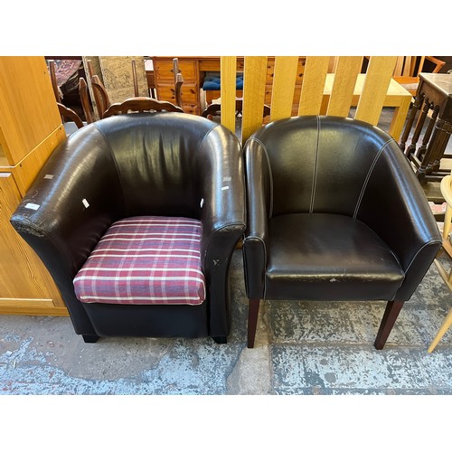 110 - Two modern black leatherette armchairs