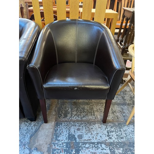 110 - Two modern black leatherette armchairs