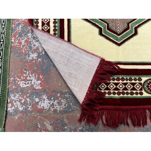 189 - Two machine woven prayer mats, one approx. 116cm x 67cm and one approx. 105cm x 67cm