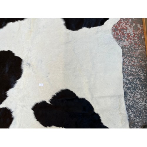 178 - A cow hide rug - approx. 236cm x 190cm