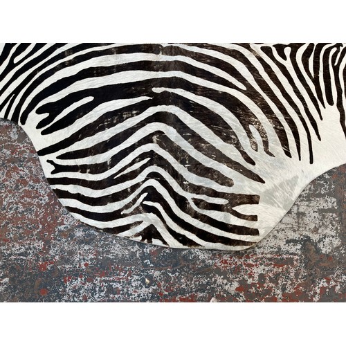 183 - A zebra hide rug - approx. 210cm x 212cm