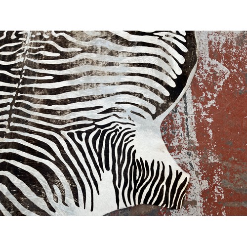 183 - A zebra hide rug - approx. 210cm x 212cm