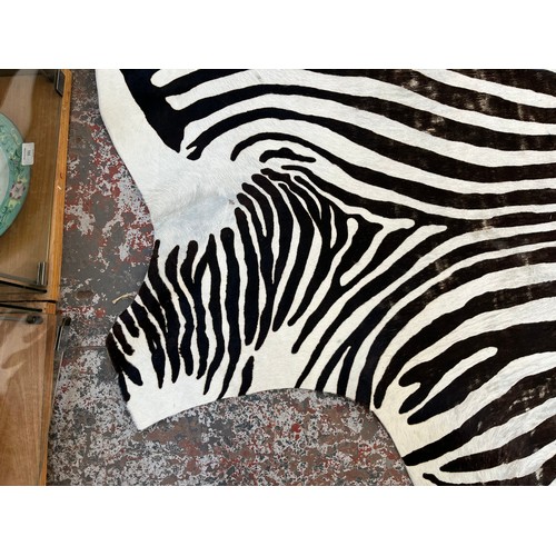 183 - A zebra hide rug - approx. 210cm x 212cm